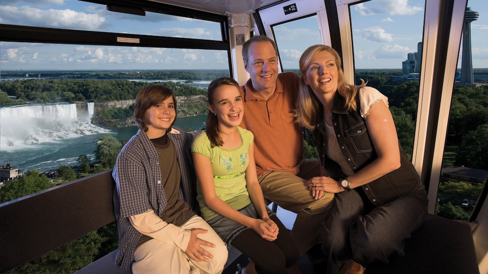 Show item 4 of 5. Family inside the Niagara SkyWheel at Niagara Falls