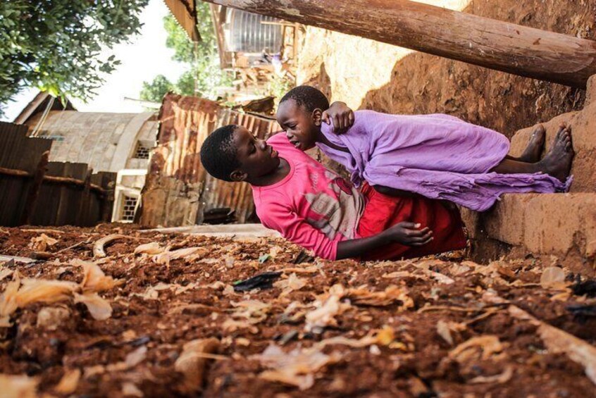 In Kibera, elder siblings help their parents take care of their younger siblings during long holidays