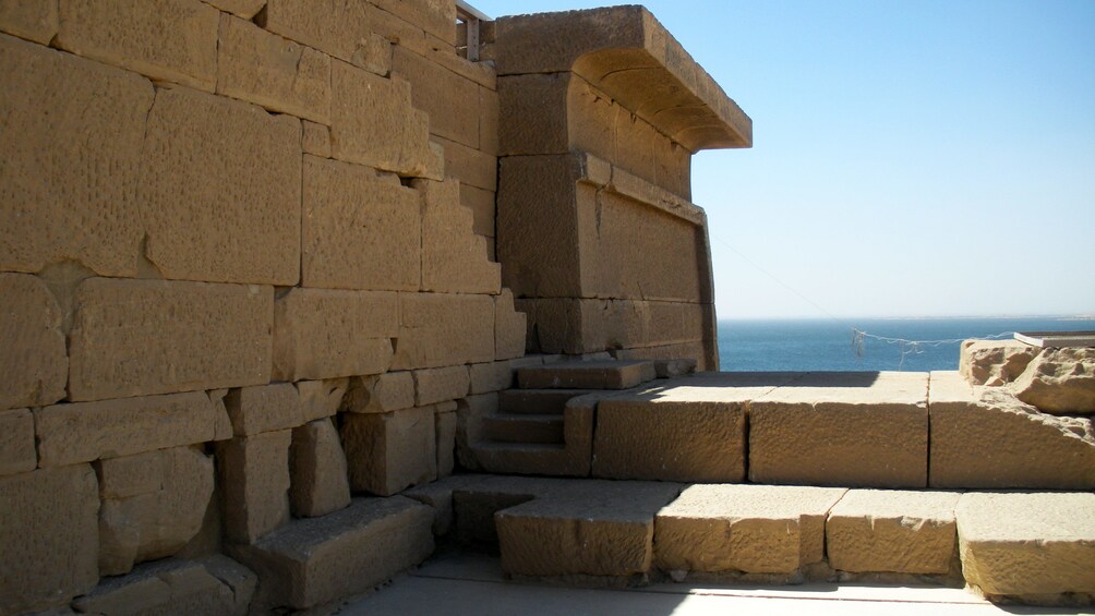 Exterior wall of the Kalabsha Temple with Lake Nasser in the background