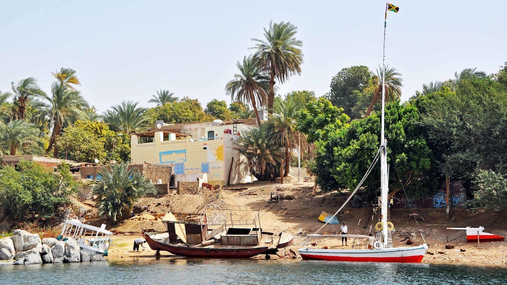 Boats docked on the shore of Elephantine Island in Aswan