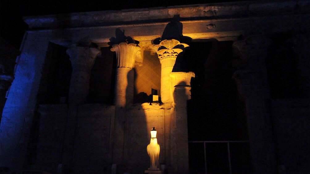 Columns of the Philae Temple lit up at night in Aswan