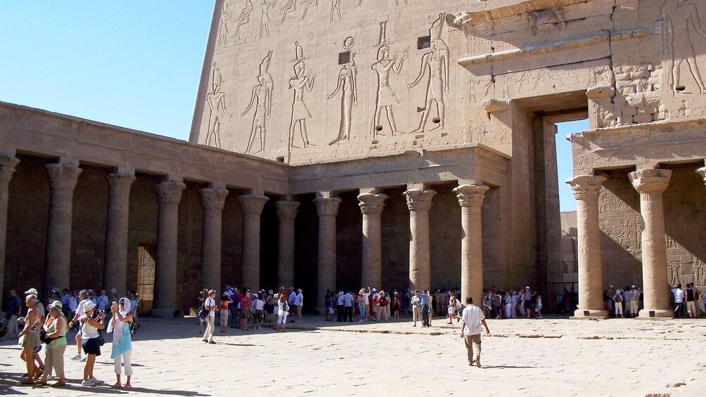People walking around inside the Temple of Edfu 