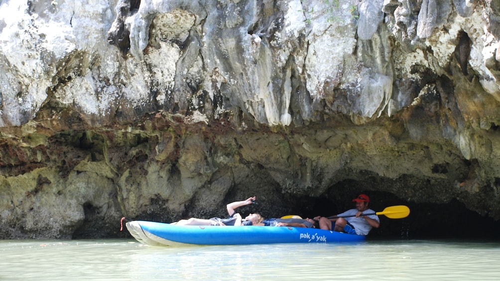 kayaking  through a low hanging cave in Phuket