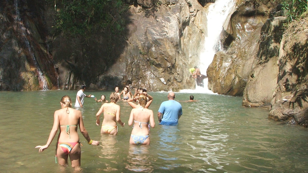 rafters enjoying downtime near the waterfall in Phuket