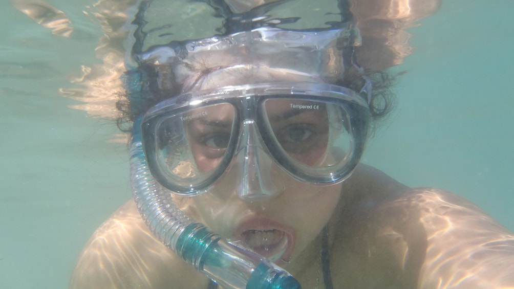 A woman snorkeling in Mahmaya