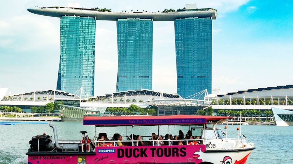 Duck floats by large unique building in Singapore