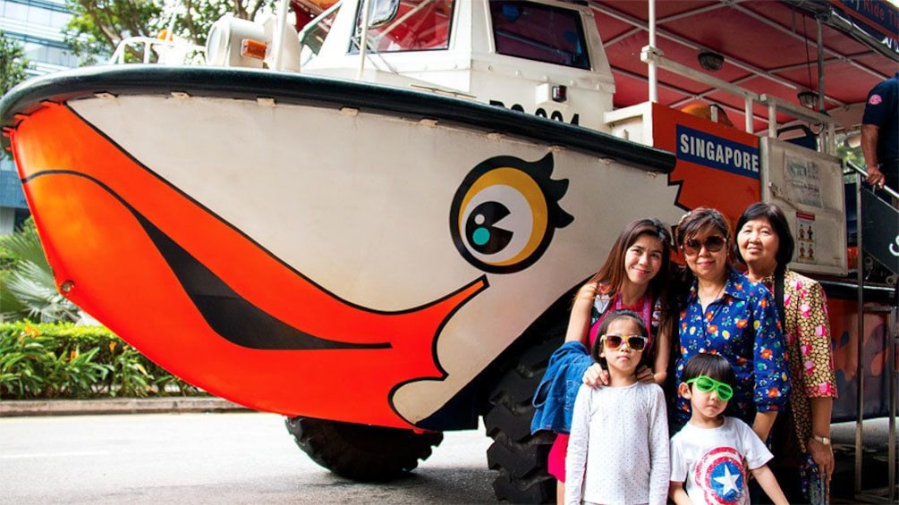 Family stands next to Duck in Singapore