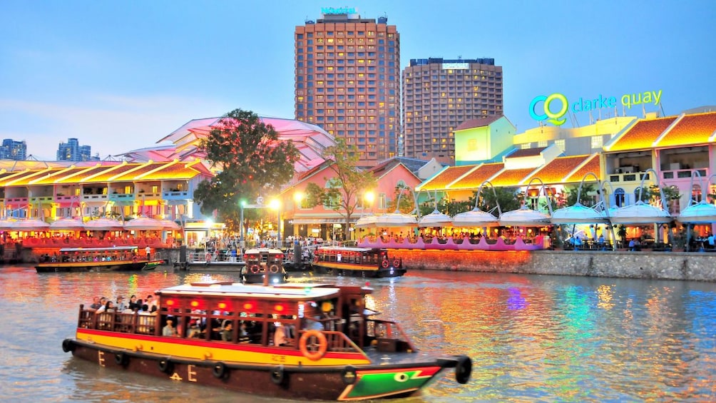 boat in the river during sunset in Singapore