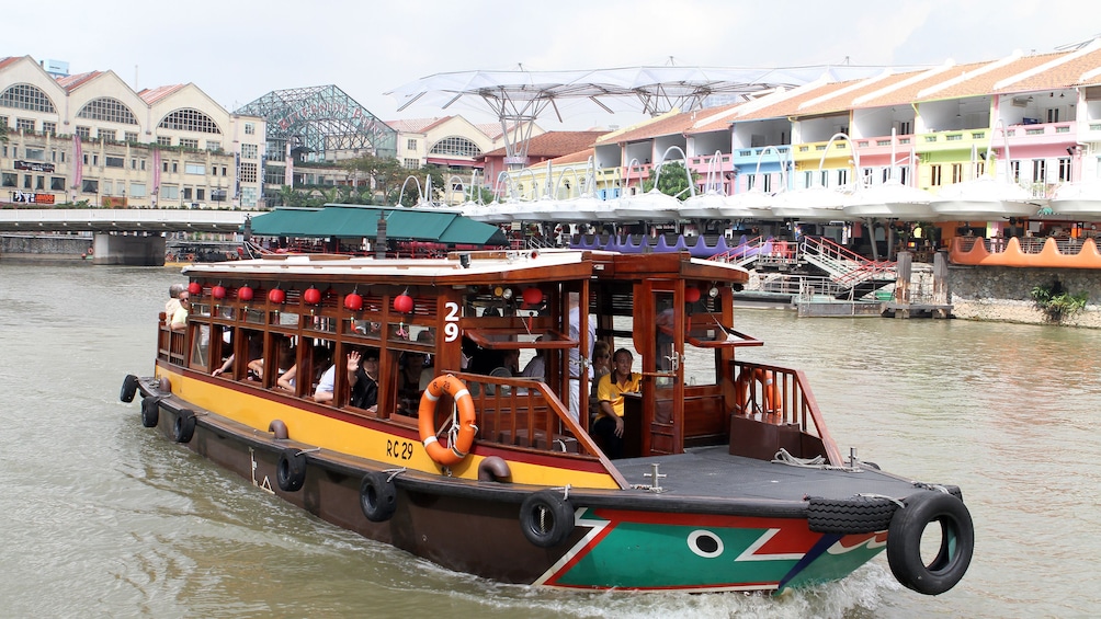 boat in the river during the day in Singapore