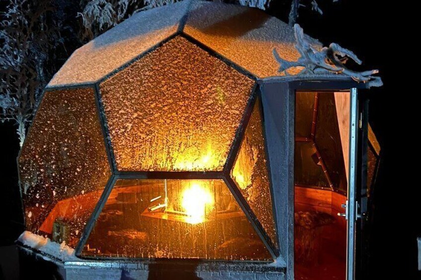 Glass Igloo Dinner on the shore of frozen Lake