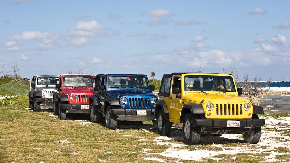 Jeeps driving along the coast in Riviera Maya