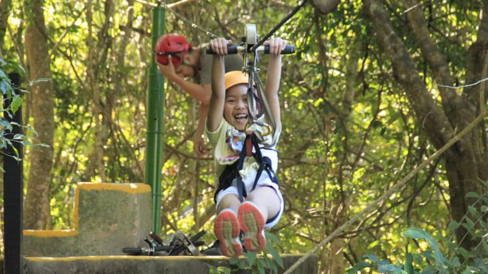 Little girl ziplining in Vallarta