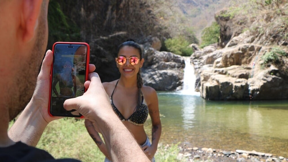 Taking a photo beside a river pool in Puerto Vallarta 