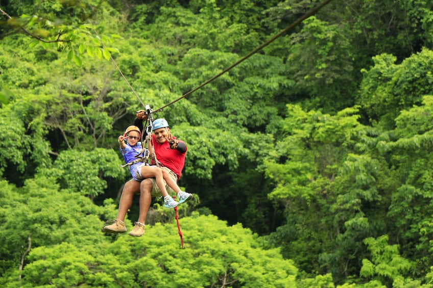 Father and daughter ziplining on Vallarta Canopy Tour