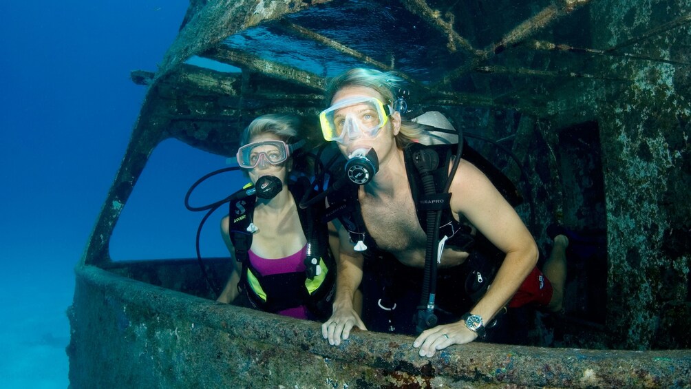 Show item 3 of 9. Scuba divers in water in Bahamas