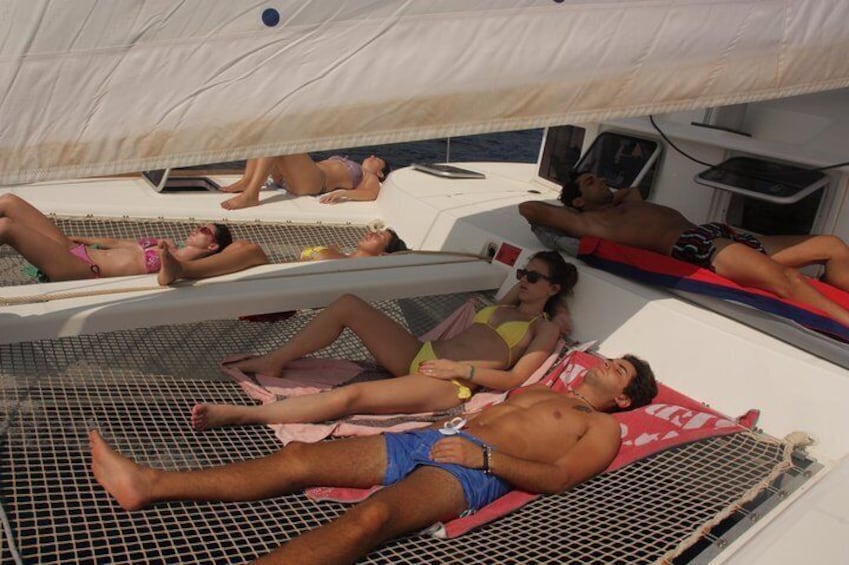 The nets on our catamaran are the perfect place to relax and sunbathe.