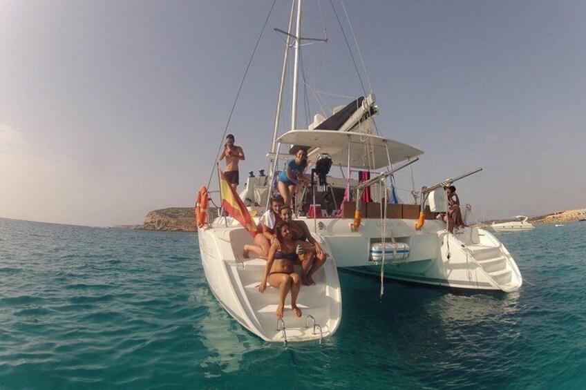 Rear view of our catamaran with happy travellers