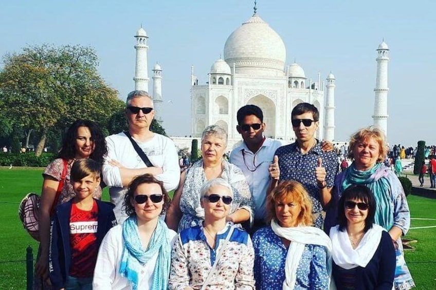 Group in Taj Mahal with tour Guide 