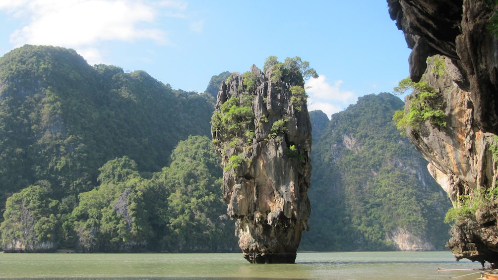 tall rock standing in the water in Phuket