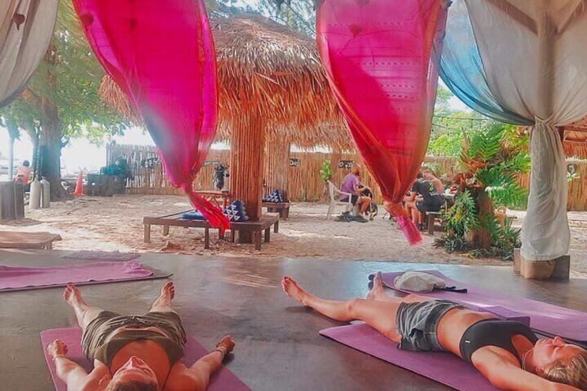 Sunrise yoga class overlooking the beach, the sea & sunrise .