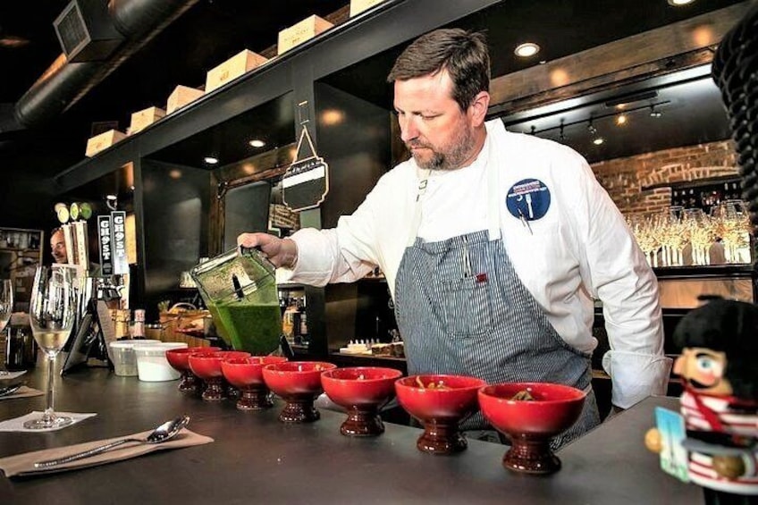 Chef Forrest demonstrates how to cook his Lowcountry specialties then serves lunch to his tour guests.