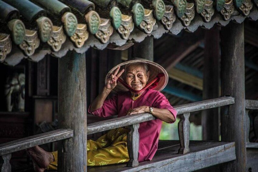 Beautiful old lady at Thanh Toan covered bridge- Culture Pham Travel