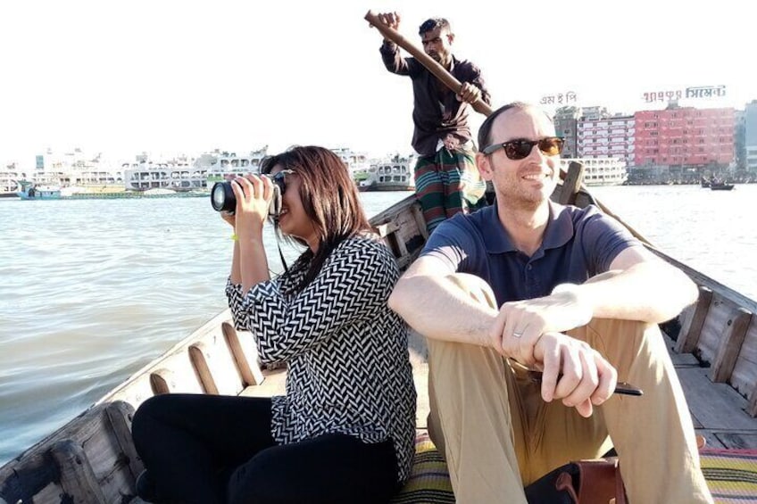 Travellers are enjoying boat ride on the river Buriganga 