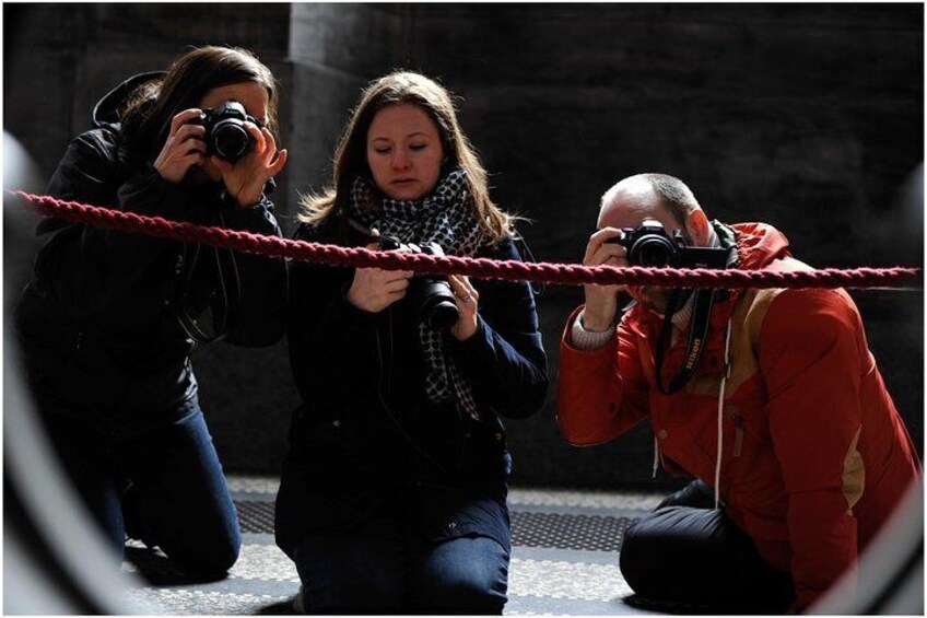 Three Beginner Photography Workshop attendees practice their new skills