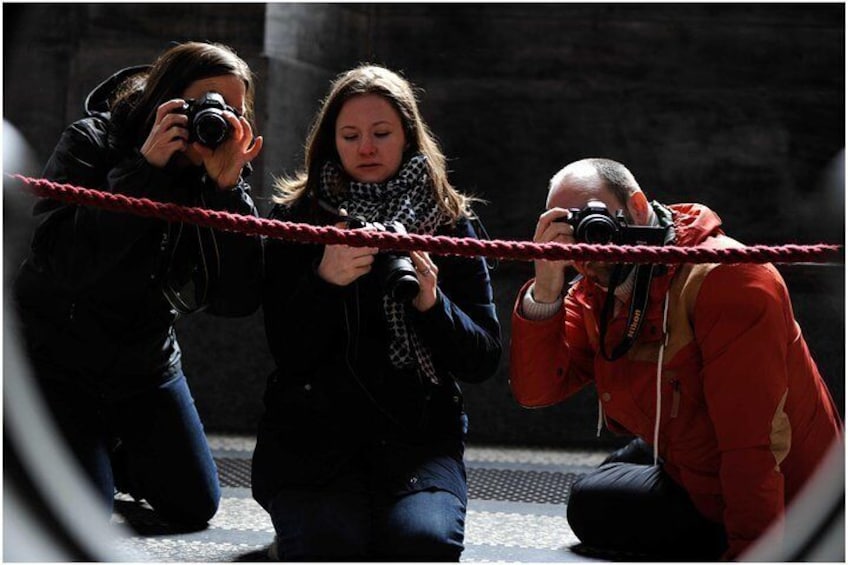 Three Beginner Photography Workshop attendees practice their new skills
