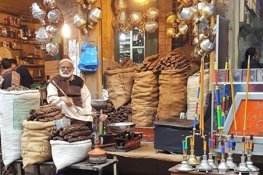 A vendor in streets of walled city Lahore selling Vape.