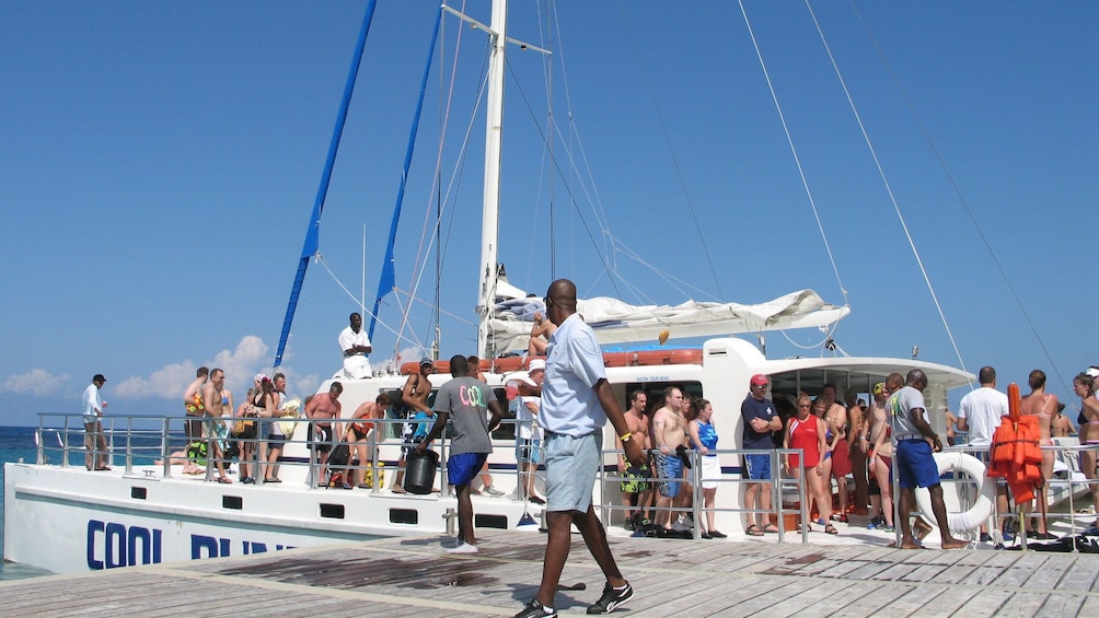 People on catamaran at the docks in Jamaica