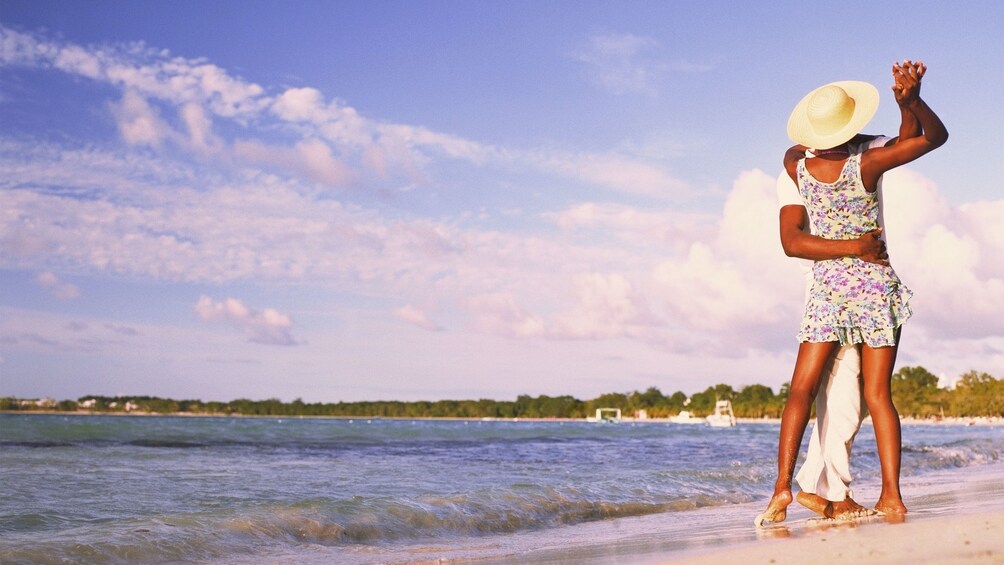 Couple dancing on the Negril beach in Jamaica 