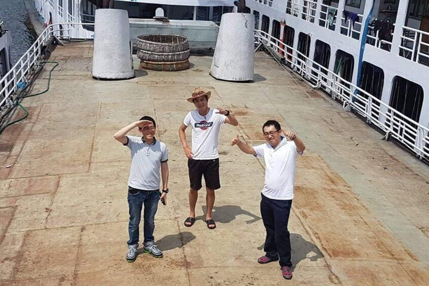 The tourists are over the deck of a vessel at Sadarghat Riverfront, Dhaka.