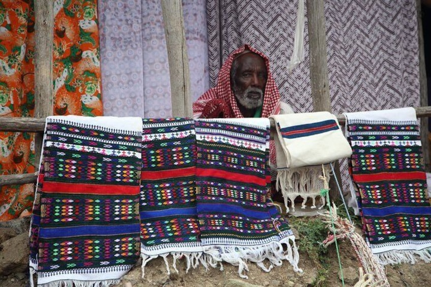 Man with handcraft at the market, Ethiopia. 