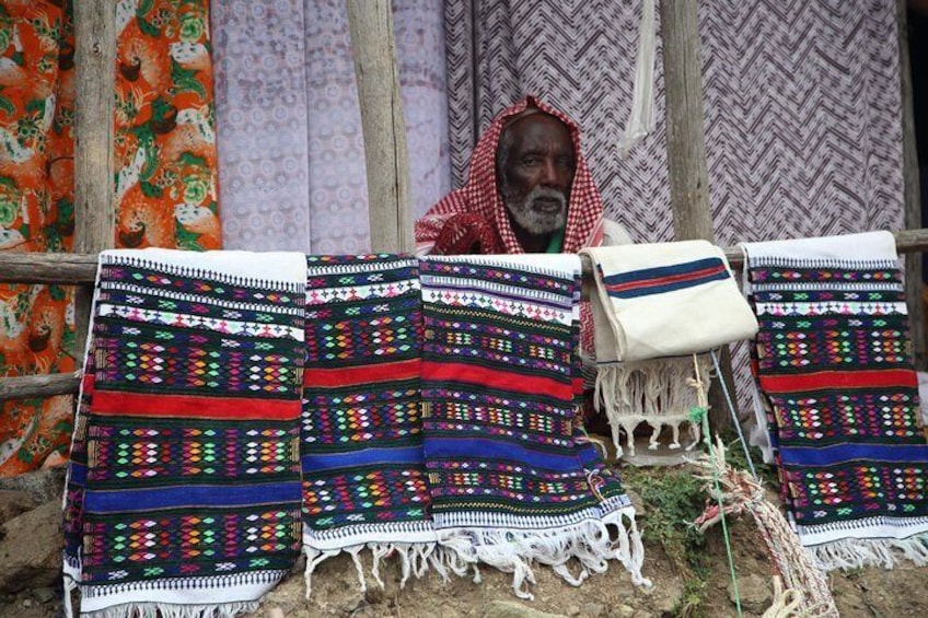 Man with handcraft at the market, Ethiopia.