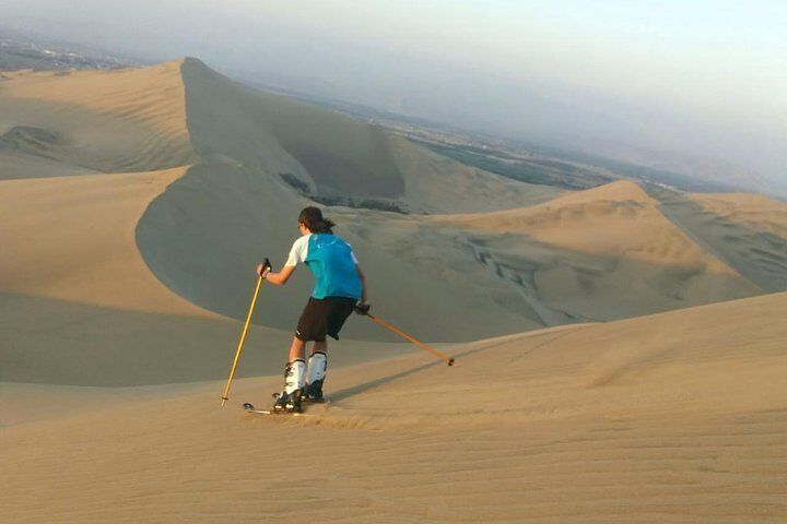 Skiing on dunes in Huacachina