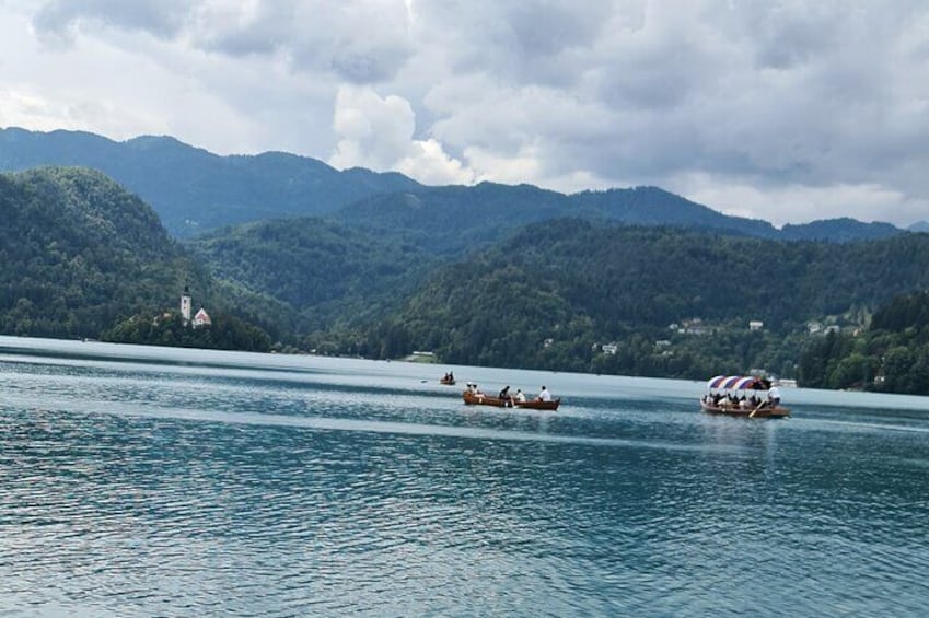 Pletna boats infront of lakes Bled island.