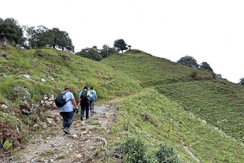 Hikers reaching Benog Hill top