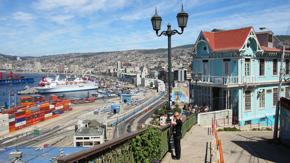 Woman looking out at the shipyard in Vina del Mar