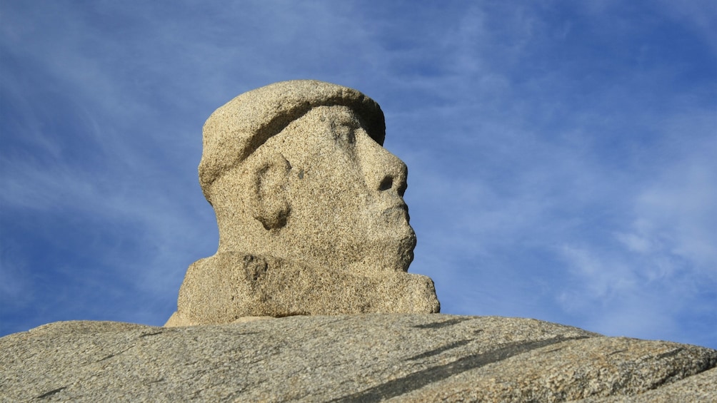 Sculpture of the poet Pablo Neruda on the beach of Isla Negra
