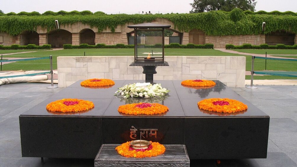 Colorful flowers adorn a memorial site in Delhi