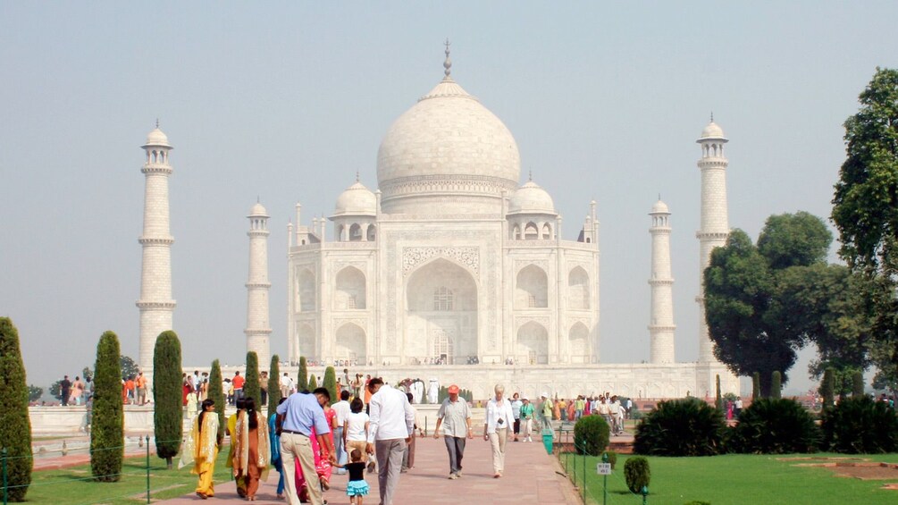 People walking towards the Taj Mahal in India