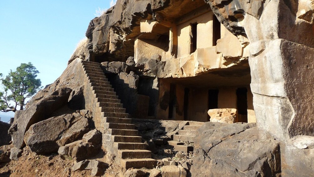 Stairs up to an ancient stone carved temple in Karla