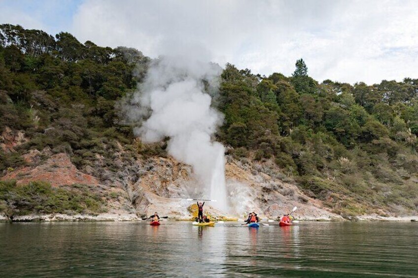 Cheering in front of geyser on Lake Rotomahana