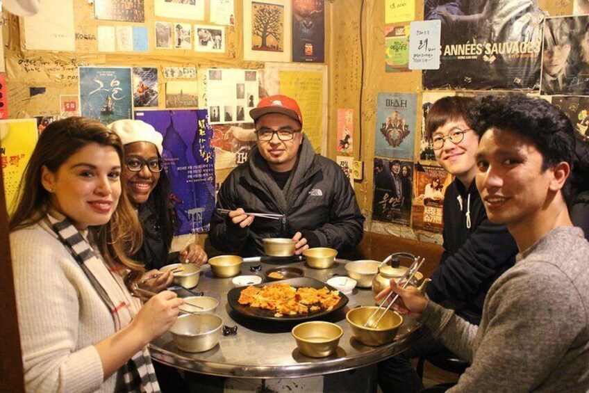 Experience a real local's life at an authentic old school Korean pub/bar. You'll taste of different types of rice wine with crispy Kimchi pancakes.