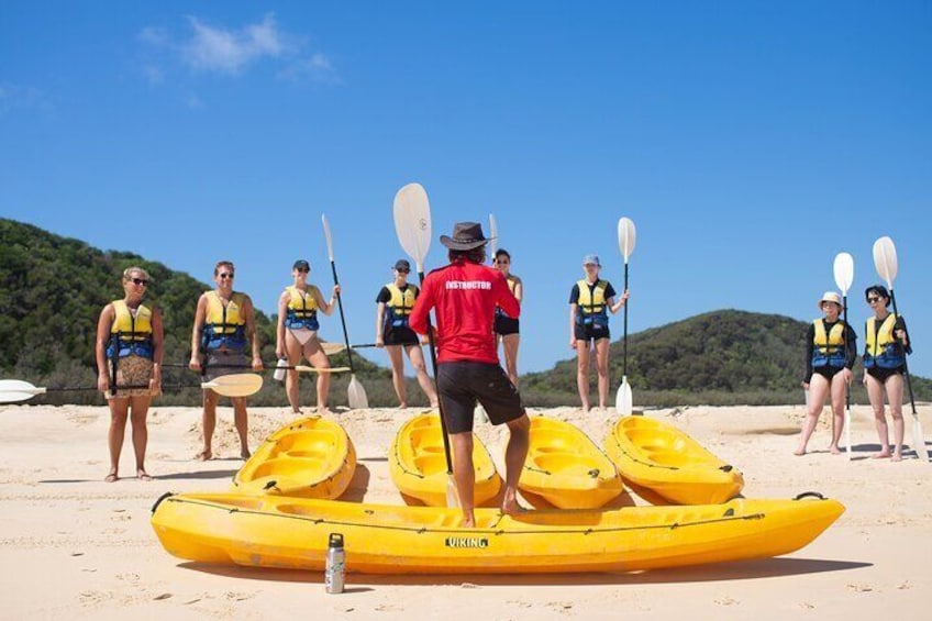 Guided kayaking instruction before entering the water