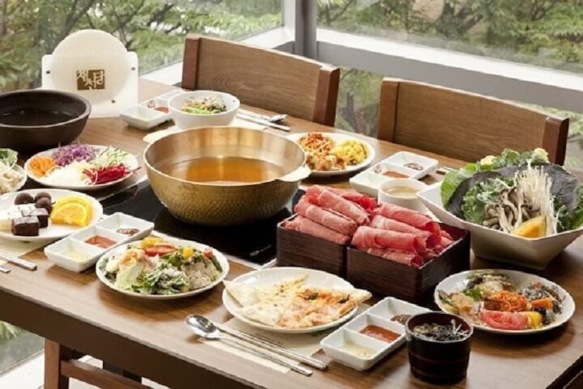 Korean-style shabu shabu. Fresh vegetables, meat, and seafood are parboiled in the pot and then eaten with chili, soy or lemon sauce.
