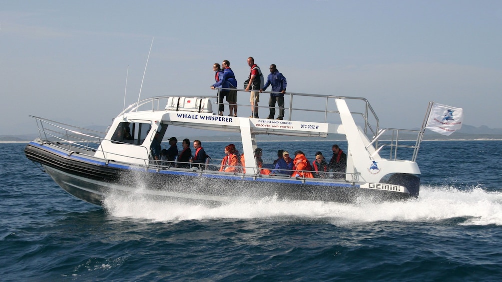 Show item 4 of 10. Whale watching boat speeding in the ocean in South Africa