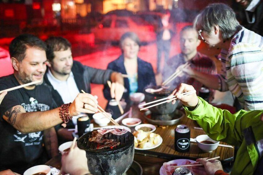 Grill your own meats and veggies at a local Beijing BBQ joint!