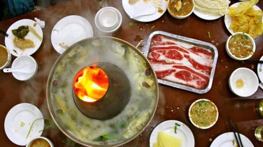 Explore the hutongs of Beijing and discover local specialties like Mongolian hotpot